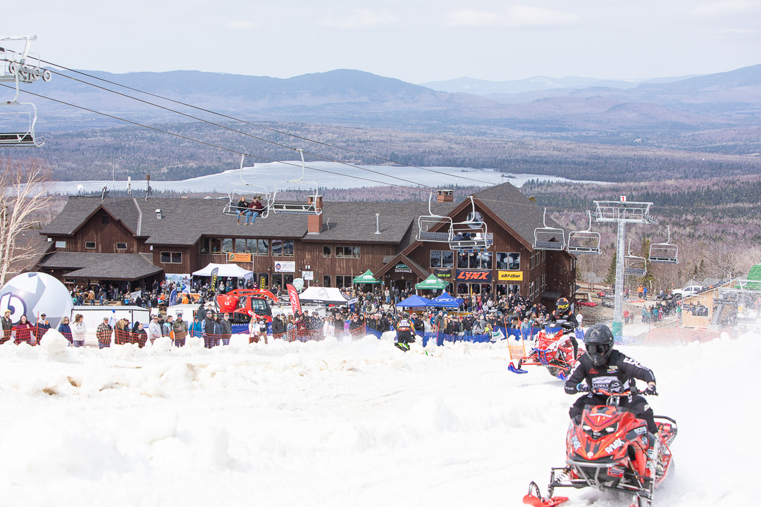 King of the Mountain snowmobile racers and spectators