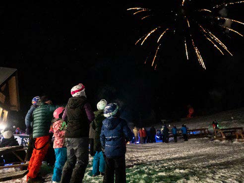 Torchlight and fireworks spectators