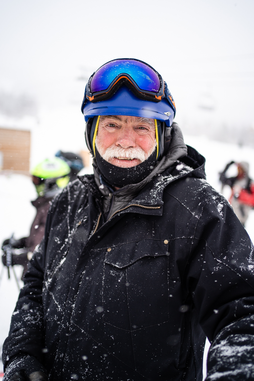 Man standing at lift load area_snow fall on jacket